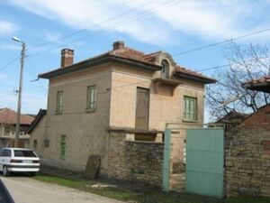 Two-storey, with a garage. It is located in a village about 