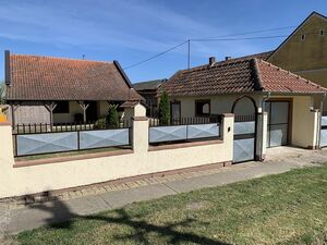 Three-room house with a large commercial building and garage