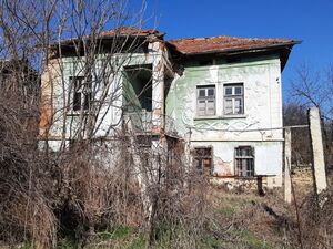 Old rural house with barn, land and mill in a quiet village