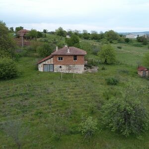 house with big land close to the sea 