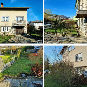 Semi-detached house with a garage and a garden shed