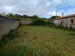 view of plot north & wall